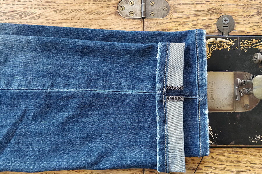 shortened jeans with reattached hem